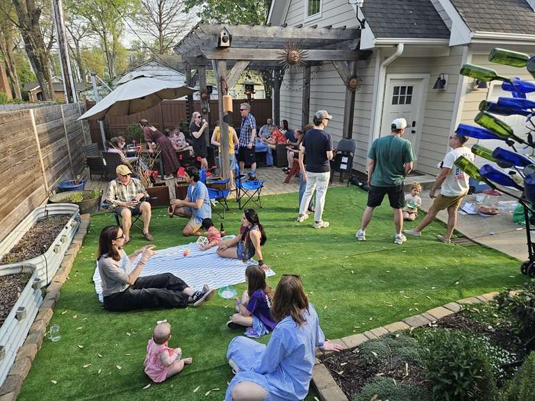 People hang out in a backyard